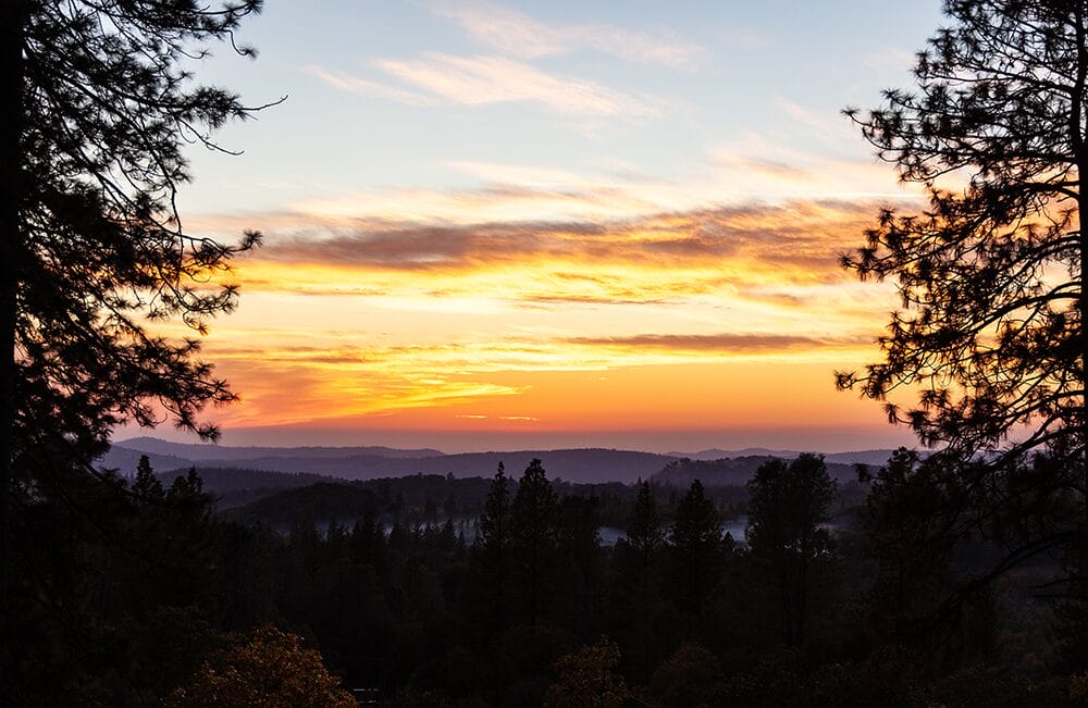 Sunset over the trees at the retreat